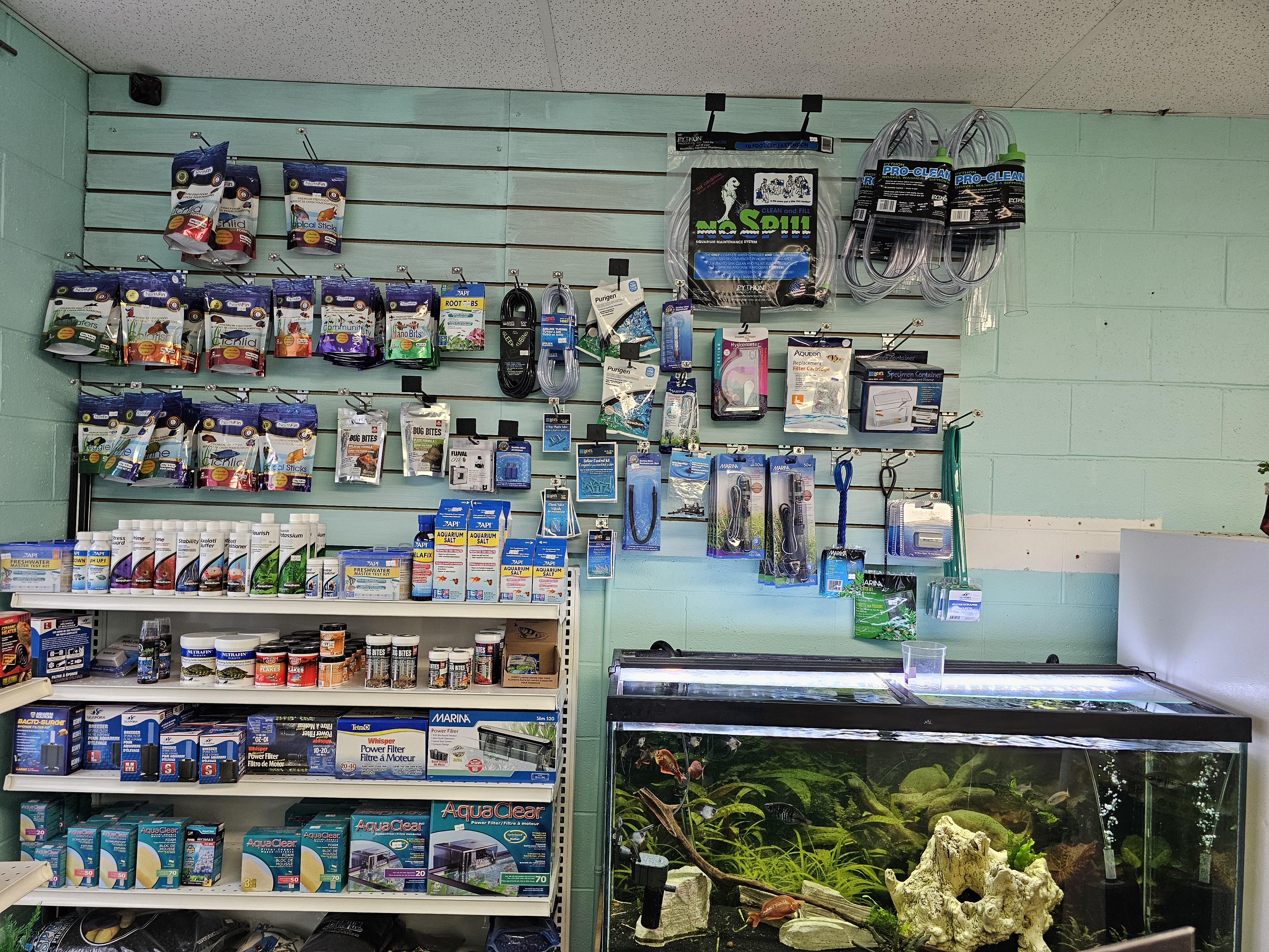 Fish supplies including filters and decorations on store shelves